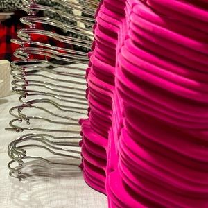 Bright hot pink velvet hangers with silver hooks